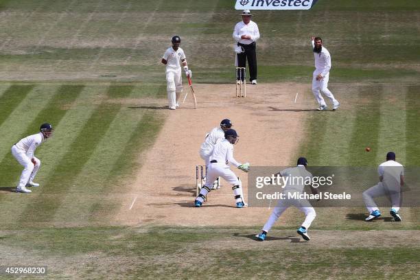 James Anderson of England takes a catch off the bowling of Moeen Ali to dismiss Bhuvneshwar Kumar of India during day five of the 3rd Investec Test...