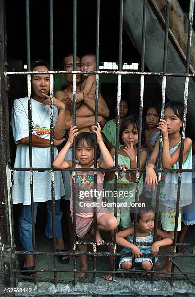 Children during visiting hours at Batang City Jail, one of four gangs at the Manila City Jail. Some of the children even live with their fathers in a...