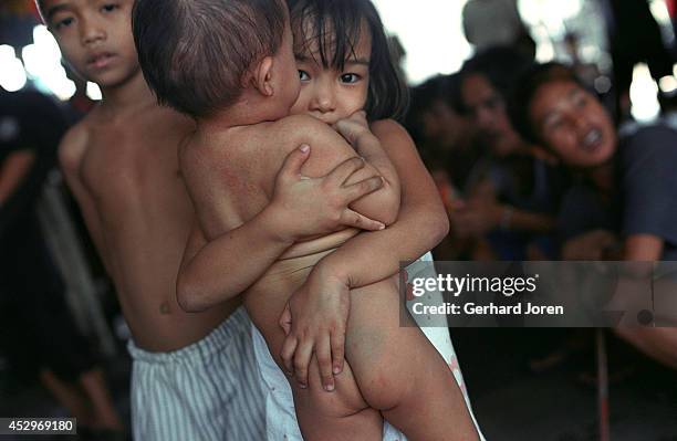 Some young children, including Jim-Boy , a six-year-old kid who lives with his father in a cell belonging to Batang City Jail, one of the four gangs...