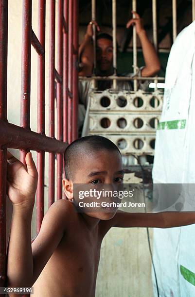 Jim-Boy, a six-year-old child who lives with his father in a cell, in the block for Batang City gang, one of four gangs at Manila City Jail. Manila...