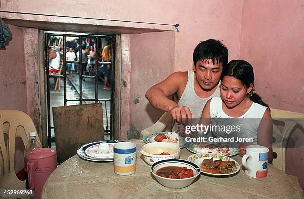 Mary Jane Palima and her boyfriend Anthony Chiu, 32 during lunch in their VIP cell at the Sputnik gang barrack at the Manila City Jail. Sputnik is...