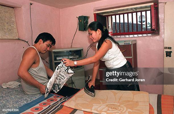 Mary Jane Palima and her boyfriend Anthony Chiu iron their laundry in their VIP cell at the Sputnik gang barrack at the Manila City Jail. Sputnik is...