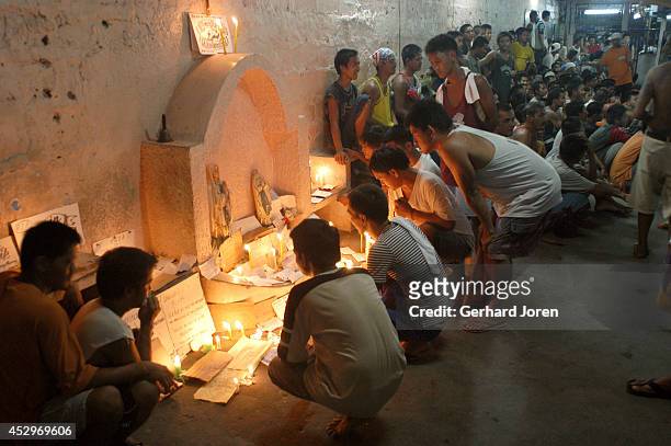 Inmates pay respect to dead members during All The Saints Day celebration at the Sputnik gang, one of 4 major gangs in Manila City Jail. The dead...