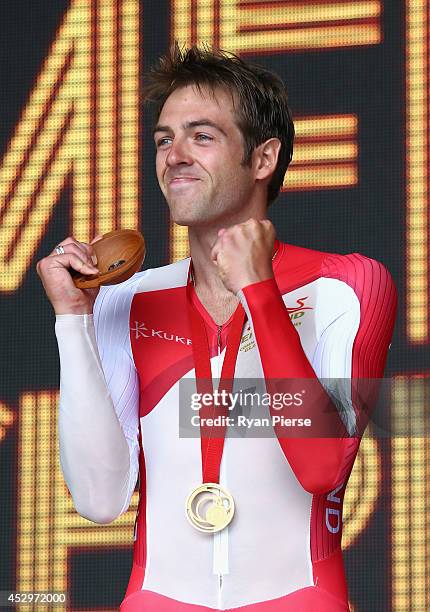 Alex Dowsett of England celebrates with this Gold medal after the Men's Cycling Road Time Trial at during day eight of the Glasgow 2014 Commonwealth...