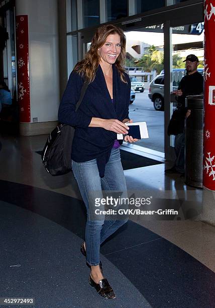 Tricia Helfer is seen arriving at Los Angeles International airport on December 01, 2013 in Los Angeles, California.