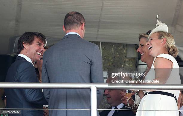 Tom Cruise jokes with Zara Phillips at Glorious Goodwood, Ladies Day at Goodwood on July 31, 2014 in Chichester, England.