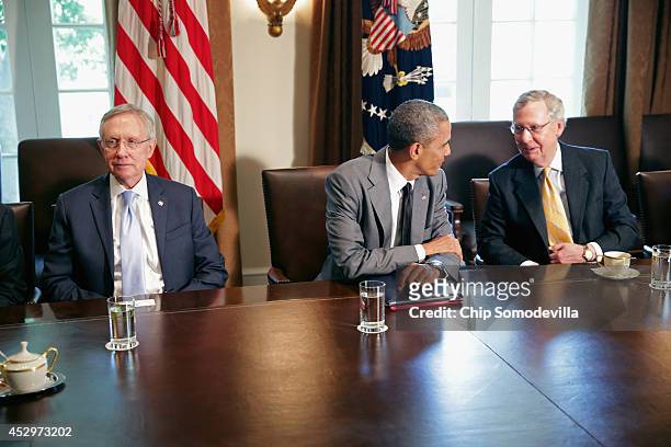 President Barack Obama meets with Senate Majority Leader Harry Reid , Senate Minority Leader Mitch McConnell and other members of Congress to discuss...