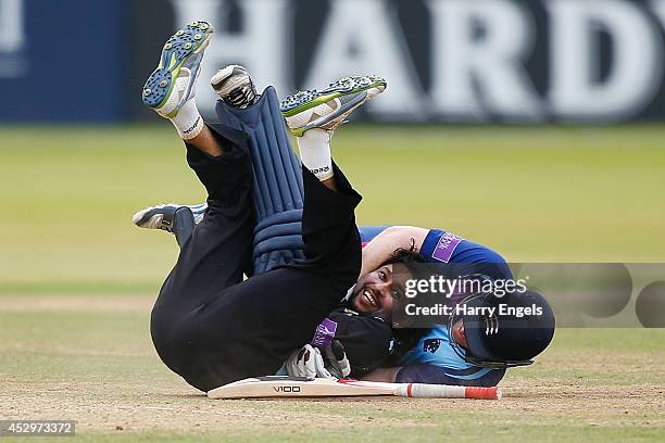 Tillakaratne Dilshan of Surrey laughs after he collided with Eoin Morgan of Middlesex during the Royal London One-Day Cup match between Middlesex...