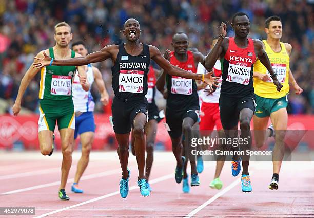 Nijel Amos of Botswana crosses the line to win gold ahead of David Rudisha of Kenya in the Men's 800 metres final at Hampden Park during day eight of...
