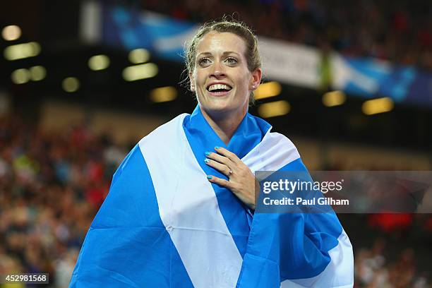 Eilidh Child of Scotland celebrates winning silver in the Women's 400 metres hurdles final at Hampden Park during day eight of the Glasgow 2014...