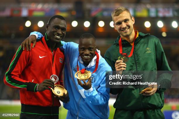 Silver medallist David Rudisha of Kenya, gold medallist Nijel Amos of Botswana and bronze medallist Andre Olivier of South Africa pose on the podium...