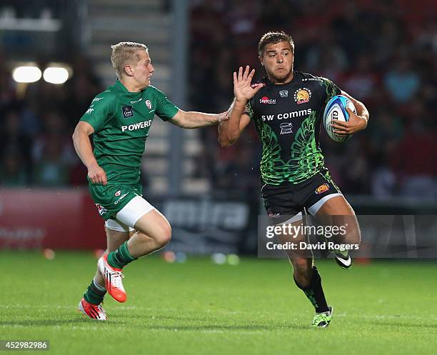 Rob Coote of Exeter Chiefs takes on Cam Cowell of London Irish tackle during the Premiership Rugby 7's Series at Kingsholm Stadium on July 31, 2014...