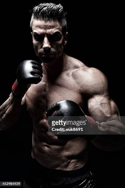 mma fighter - mixed martial arts stock pictures, royalty-free photos & images