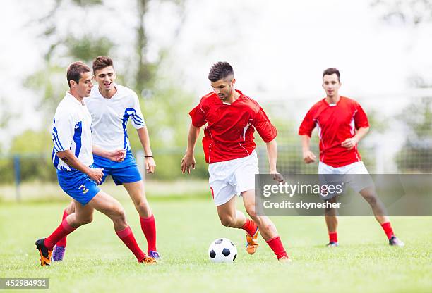 soccer players in action. - professional soccer team stock pictures, royalty-free photos & images