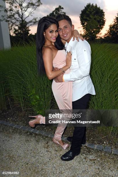 Playmate Mia Gray and her boyfriend Oliver Kobs attend the 'Citroen C4 Cactus' Munich Preview at Leonardo Royal Hotel on July 31, 2014 in Munich,...