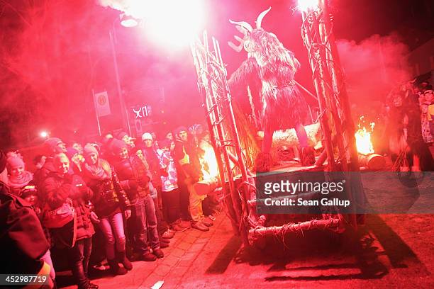 Member of the Haiminger Krampusgruppe dressed as the Krampus creature arrives on a fiery cart on the town square during the annual Krampus night in...