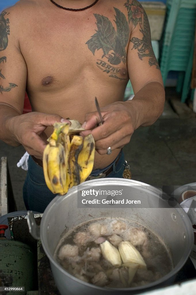 A convicted inmate on death row cooks his dinner in the cell...