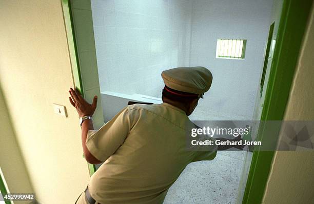 Guard at a cell in the new lethal injection building, at Bang Kwang Central Prison. Prisoners are led to a cell on the same day as the execution. The...