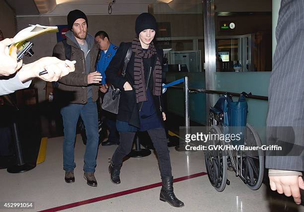 Rooney Mara and Charlie McDowell are seen at Los Angeles International Airport on January 11, 2012 in Los Angeles, California.