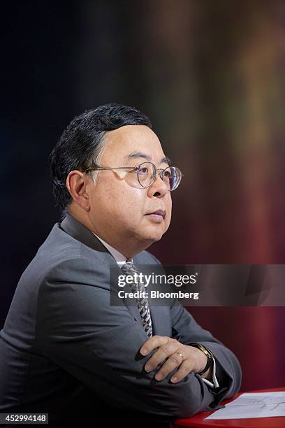 Ronnie Chan, chairman of Hang Lung Properties Ltd., listens during a Bloomberg Television interview in Hong Kong, China, on Friday, Aug. 1, 2014....