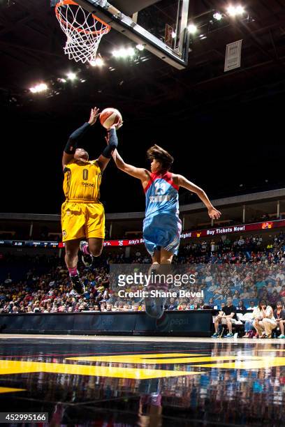 Odyssey Sims of the Tulsa Shock shoots against Shoni Schimmel of the Atlanta Dream during the WNBA game on July 31, 2014 at the BOK Center in Tulsa,...