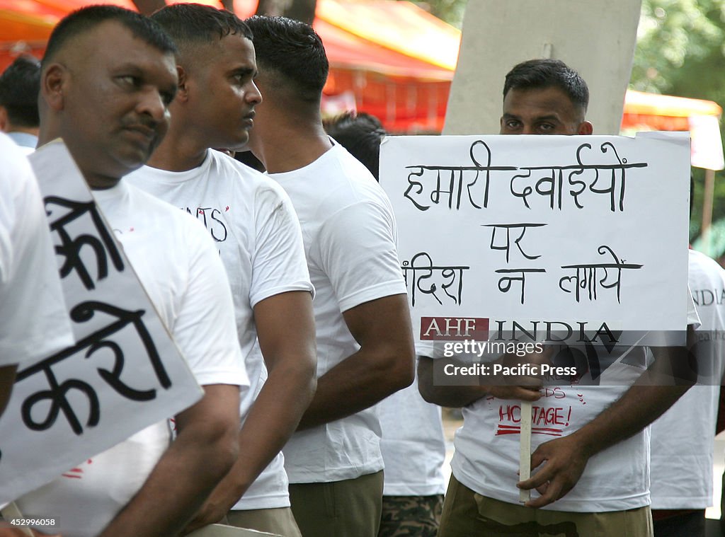 Activists of AIDS Healthcare foundation(AHF) holds placards...