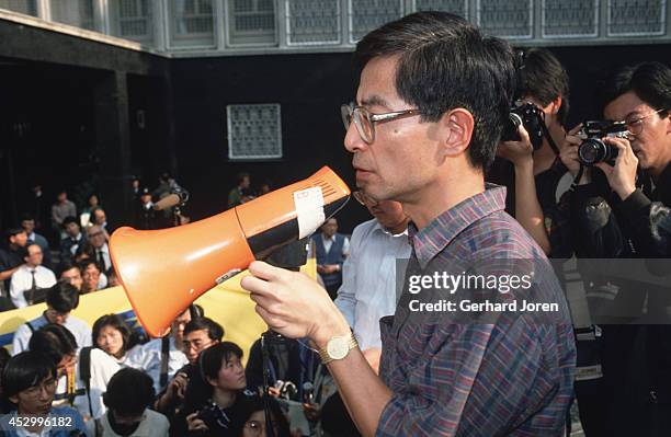 Martin C.M. Lee leads a demonstration outside a government building in Central Hong Kong. Lee is a political activist and a barrister. He was...