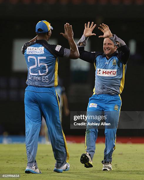 Roelof van der Merwe and Johnson Charles celebrate during a match between St. Lucia Zouks and Barbados Tridents as part of week 4 of the Limacol...