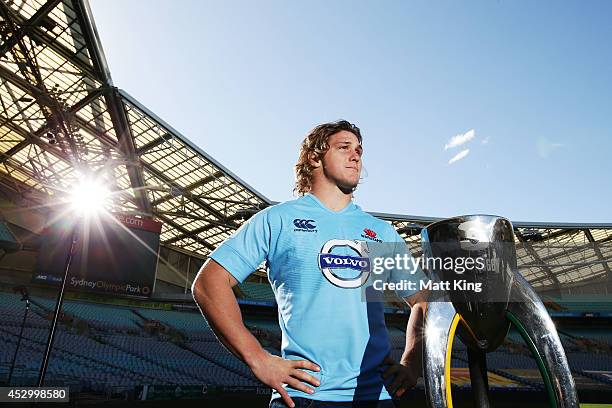 Waratahs captain Michael Hooper poses with the Super Rugby trophy during the Super Rugby media opportunity at ANZ Stadium on August 1, 2014 ahead of...