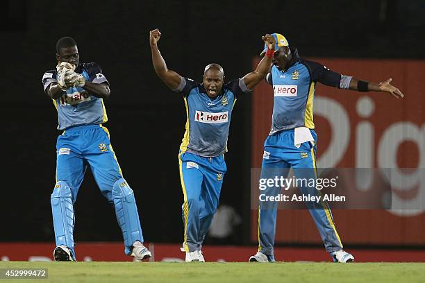 Tino Best, Andre Fletcher and Darren Sammy celebrate during a match between St. Lucia Zouks and Barbados Tridents as part of week 4 of the Limacol...