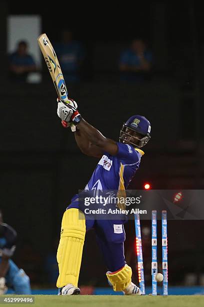 Kyle Mayers is bowled during a match between St. Lucia Zouks and Barbados Tridents as part of week 4 of the Limacol Caribbean Premier League 2014 at...