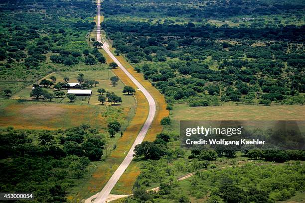 Texas, Near Junction Aerial Photo Of Road With Wildflowers On Side.