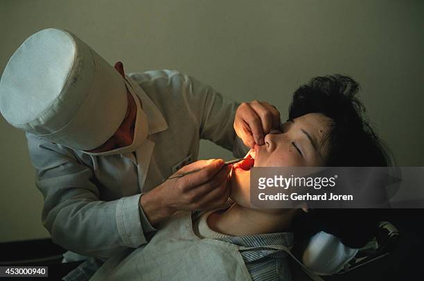 Dentist treats a patient at the Pyongyang Maternity Hospital. Only selected patients are treated at this high class hospital.