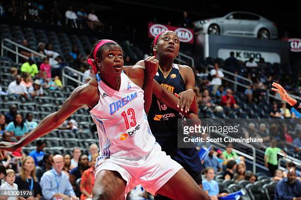 Aneika Henry of the Atlanta Dream boxes out against Chiney Ogwumike of the Connecticut Sun on July 29, 2014 at Philips Arena in Atlanta, Georgia....