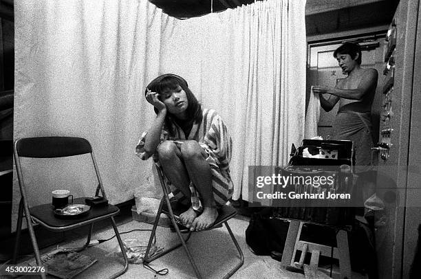 Mizuho Tohno, a nineteen-year-old porn actress, takes a break between shoots in the making of a movie in Tokyo. She signed up to make ten movies at...