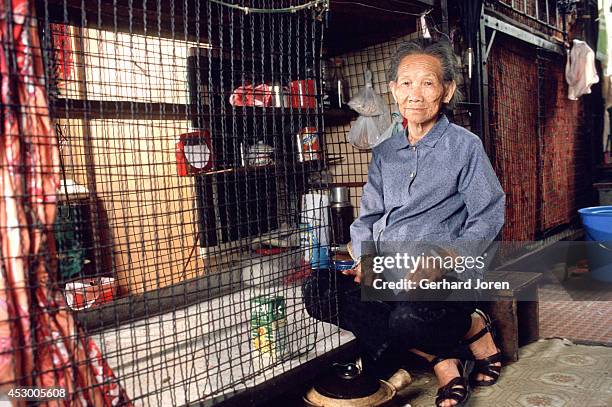 This 84-year old woman lives in a cage bed in a crowded apartment in Mong Kok district in Hong Kong. She pays US$ 40 a month for two square meters,...