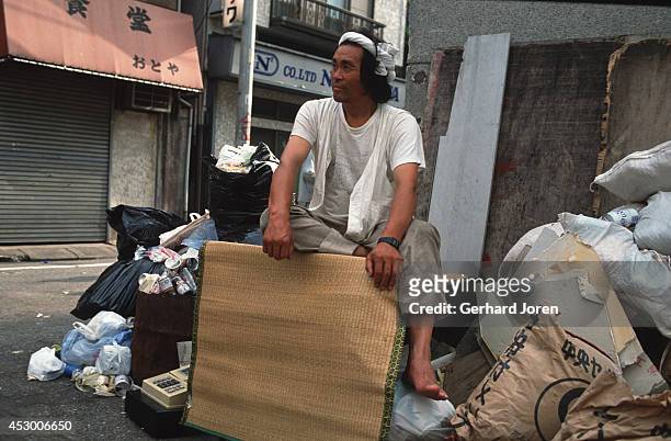 Homeless man with his belongings in Sanya district, Tokyo. He makes a living as a day worker at construction sites.