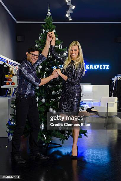 Fashion designer Richard Kravetz and TV host Nadine Krueger pose during a photo session in front of a christmas tree on December 01, 2013 in Berlin,...