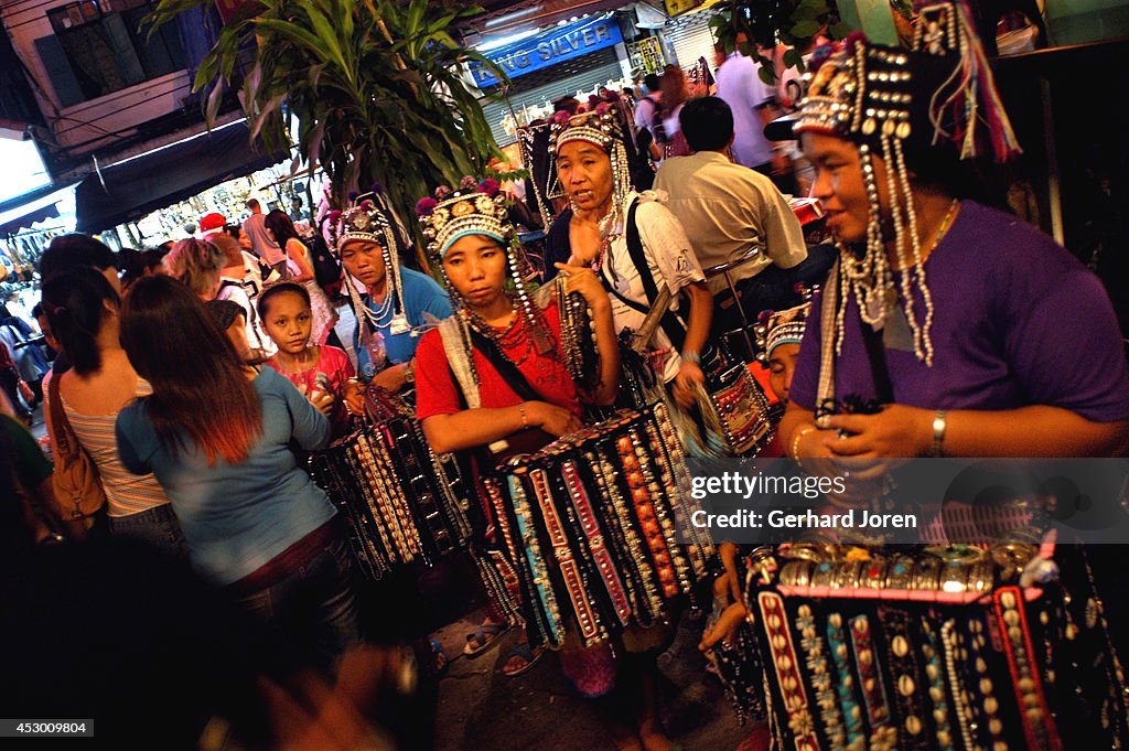 Akha hill tribes try to sell some products to tourists on...