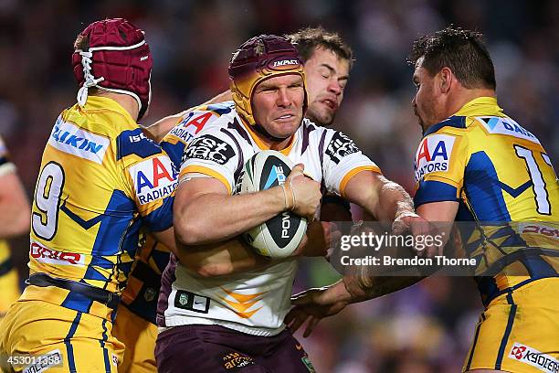 Todd Lowrie of the Broncos is tackled by the Sea Eagles defence during the round 21 NRL match between the Manly-Warringah Sea Eagles and the Brisbane...