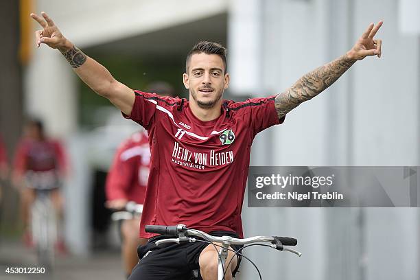 Joselu of Hanover gestures while riding a bicycle at Hannover 96 training camp on August 01, 2014 in Mureck, Austria.