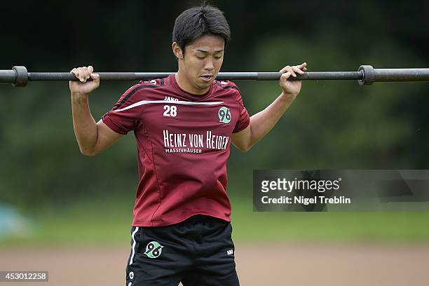 Hiroshi Kiyotake of Hanover lifts weights at Hannover 96 training camp on August 1, 2014 in Mureck, Austria.