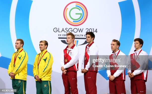 Gold medalists Jack Laugher and Chris Mears of England pose with Silver medalists Matthew Mitcham and Grant Nel of Australia and Bronze medalists...