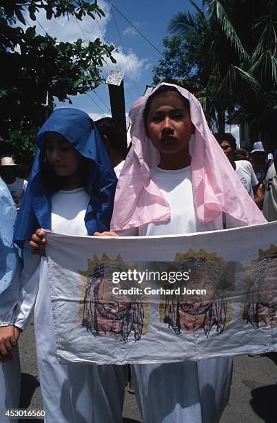 Participants dressed up as Virgin Mary before a crucifixion on Good Friday in the Cutud district of San Pedro town, 80 kilometers north of Manila....