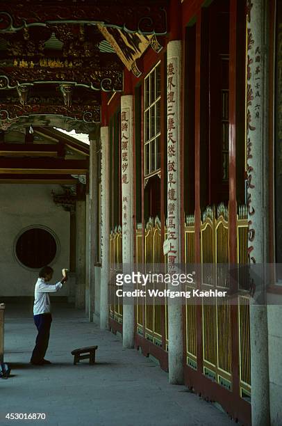 China, Xiamen, South Putuo Temple , Woman Worshipping.