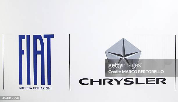 Photo taken on August 1, 2014 shows the logo of Fiat - Chrysler in front of Fiat Headquarters at Lingotto in Turin. Shareholders in Italian carmaker...