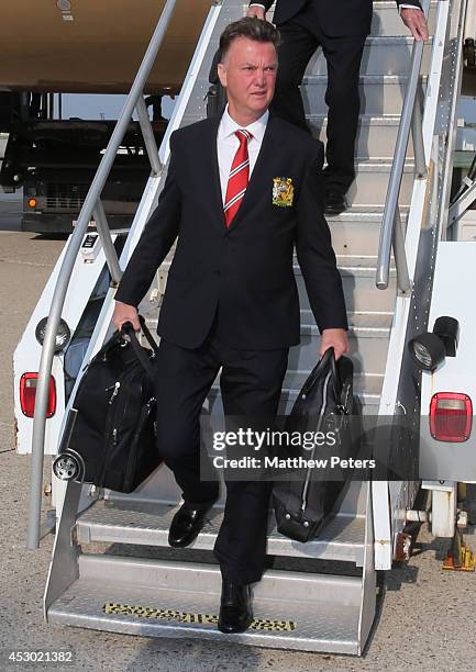 Manager Louis van Gaal of Manchester United arrives in Detroit as part of their pre-season tour of the United States on July 31, 2014 in Detroit,...