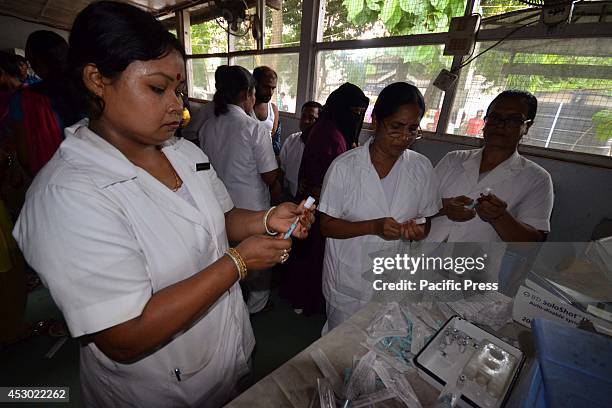 The nurse prepares the vaccine against Japanese encephalitis in the Nagaon, 180km East of Guwahati. Vaccines are urgently needed in Assam to stop the...