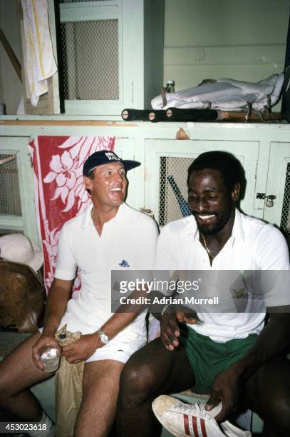 England and Yorkshire batsman Geoff Boycott shares a joke with West Indies batsman Viv Richards in the dressing room during the 1981 Test series...