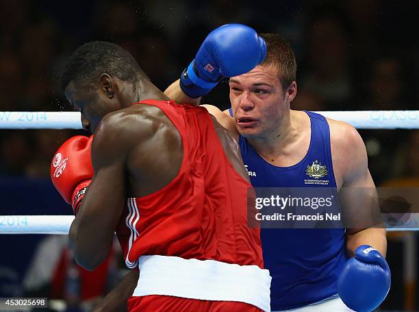 Efe Ajagba of Nigeria competes with Joseph Goodall of Australia during the Men's Super heavy +91 kg Semi-Finals Boxing at Scottish Exhibition And...